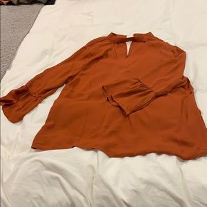 Burnt orange ruffle sleeve blouse